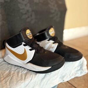 Nike high top tennis and Velcro slip-on tennis shoe.